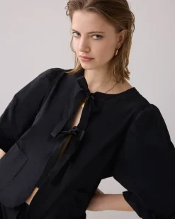 Blouse jacket with bow fastening