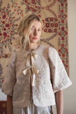 Blouse jacket with bow fastening