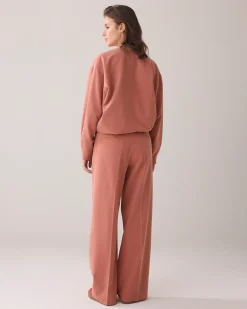 Trousers with pleated waistband